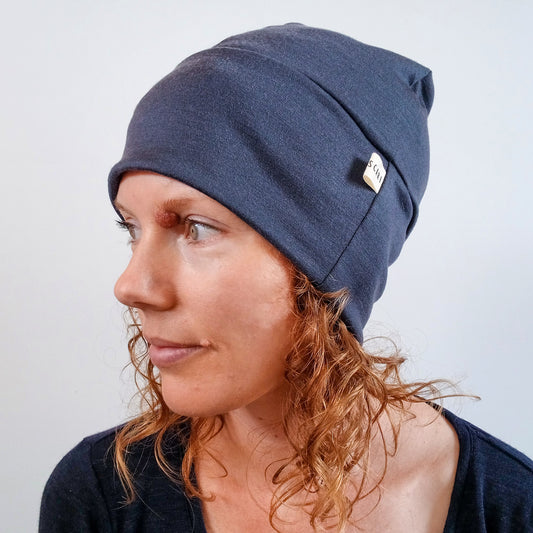 Woman wearing a stone grey merino beanie
