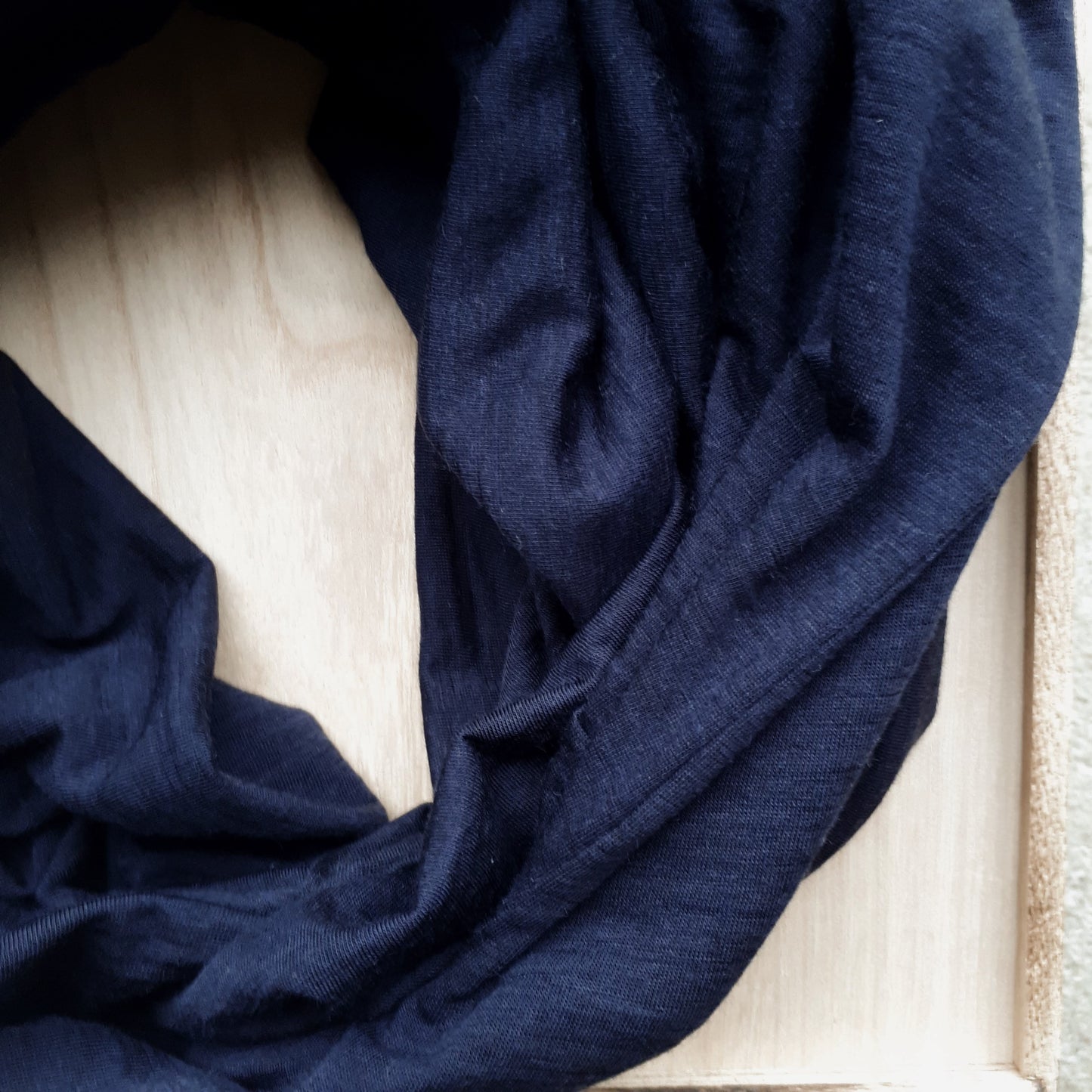 Close up of ink blue merino fabric